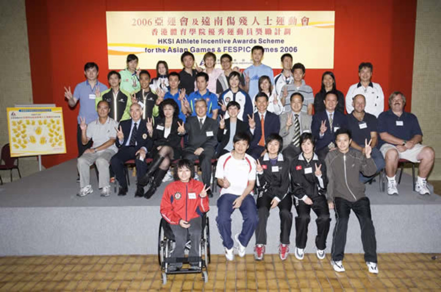 <p>Three officiating guests including Dr Eric Li, Chairman of the HKSI (fourth from left of second row), Mrs Vivien Fung, Chef de Mission of the Hong Kong Delegation to the 15<sup>th</sup> Doha Asian Games (third from left of second row), and Mrs Jenny Fung, Chairman of the Hong Kong Paralympic Committee &amp; Sports Association for the Physically Disabled (fifth from left of second row) and guests from other sporting organisations cheer Hong Kong athletes at the Launch Ceremony of the Hong Kong Sports Institute Athlete Incentive Awards Scheme before their participation in the upcoming Asian Games &amp; FESPIC Games.</p>
