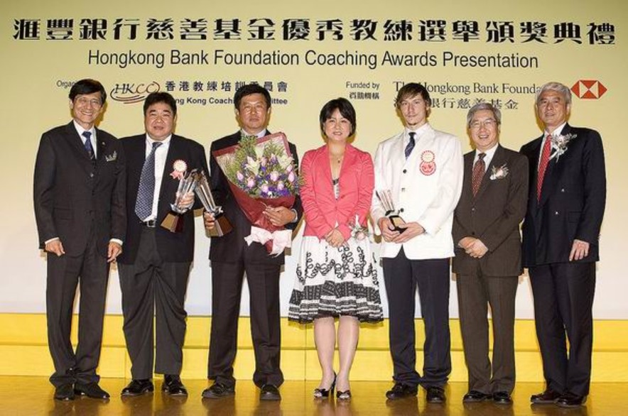 <p>Group photo of officiating guests and recipients of the Coach of the Year Awards. From right to left: Professor Frank Fu, Chairman of the Hong Kong Coaching Committee; Dr Eric Li, Chairman of the Hong Kong Sports Institute; fencing coach Geza Marffy; Ms Teresa Au, Head of Corporate Sustainability Asia Pacific Region of The Hongkong and Shanghai Banking Corporation Limited; cycling coach Shen Jinkang, squash coach Tony Choi and Mr Pang Chung, Hon Secretary General of the Sports Federation &amp; Olympic Committee of Hong Kong, China.</p>
