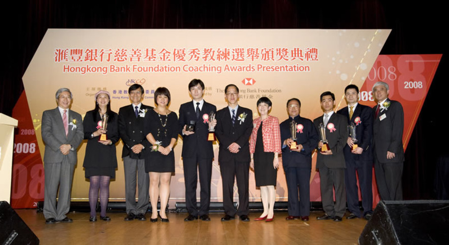 <p>Group photo of officiating guests and recipients of the Coach of the Year Awards and the Distinguished Services Award for Coaching. From left to right: Dr Eric Li, Chairman of the Hong Kong Sports Institute; table tennis coach Li Huifeng; Pang Chung, Hon Secretary General of the Sports Federation &amp; Olympic Committee of Hong Kong, China; Teresa Au, Head of Corporate Sustainability Asia Pacific Region of The Hongkong and Shanghai Banking Corporation Limited; wheelchair fencing coach Zheng Kang-zhao; Tsang Tak-sing, Secretary for Home Affairs; Mrs Jenny Fung, Chairman of the Hong Kong Paralympic Committee and Sports Association for the Physically Disabled; wushu coach Yu Liguang; wushu coach Wong Chi-kwong; badminton coach Liu Zhiheng; and Professor Frank Fu, Chairman of the Hong Kong Coaching Committee.</p>
